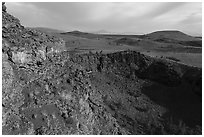 Echo crater with brightly colored rocks and Crescent Butte. Craters of the Moon National Monument and Preserve, Idaho, USA ( black and white)