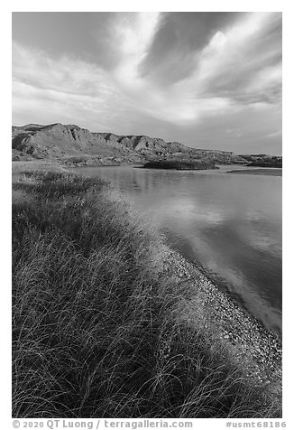 Grassy river shore and bluffs near Wood Bottom. Upper Missouri River Breaks National Monument, Montana, USA (black and white)