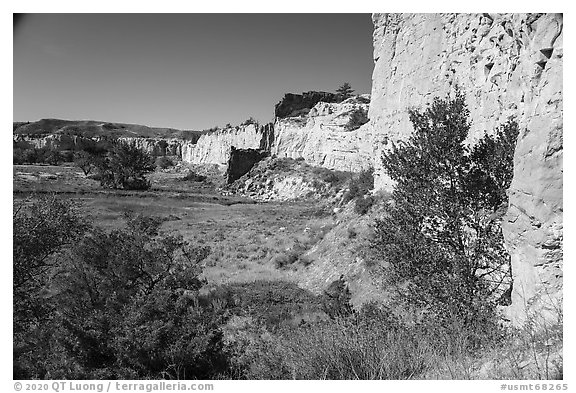 Sandstone cliffs surround native campsite. Upper Missouri River Breaks National Monument, Montana, USA (black and white)
