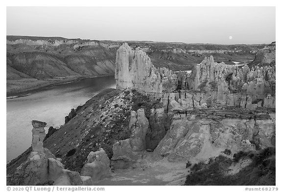 Sandstone pinnacles and moon. Upper Missouri River Breaks National Monument, Montana, USA (black and white)