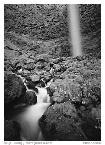 Mossy boulders and Watson Falls. Oregon, USA (black and white)