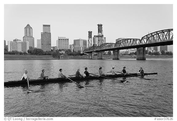 Eight-oar shell on Williamette River and city skyline. Portland, Oregon, USA