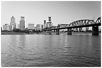Portland skyline, Hawthorne Bridge, and Williamette River at sunrise. Portland, Oregon, USA (black and white)