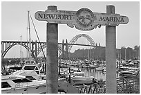 Newport marina and sign, foggy sunrise. Newport, Oregon, USA ( black and white)
