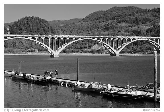 Small boat deck and Rogue River bridge. Oregon, USA