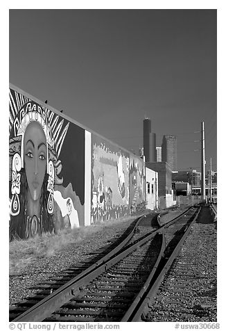 Railroad, mural, and high-rise towers. Seattle, Washington (black and white)