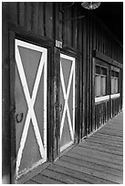 Painted doors and wood building, Winthrop. Washington ( black and white)