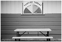 Bench and vampire threat sign near Forks. Olympic Peninsula, Washington ( black and white)