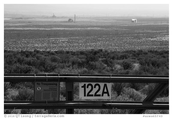 Fence and distant nuclear reactors, Hanford Reach. Washington (black and white)