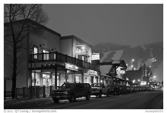 Storehouses and night-lit Snow King ski area. Jackson, Wyoming, USA (black and white)