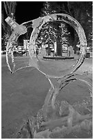 Town square statue framed by ice sculpture. Jackson, Wyoming, USA (black and white)