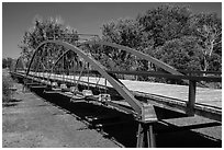 Three-span bowstring through truss bridge over the North Platte River. Fort Laramie National Historical Site, Wyoming, USA ( black and white)