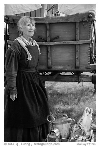 Woman with Pionneer wagon. Fort Laramie National Historical Site, Wyoming, USA (black and white)