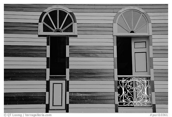 Red window shutters and striped walls, Parc De Bombas, Ponce. Puerto Rico (black and white)