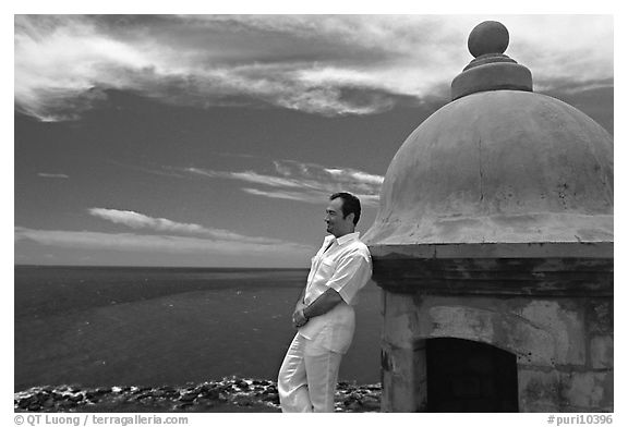 Man leaning against a lookout turret, Fort San Felipe del Morro. San Juan, Puerto Rico