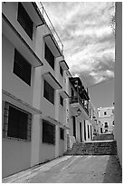 Passage with modern painted houses. San Juan, Puerto Rico (black and white)