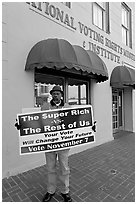 African-American man holding a voting sign in front of the voting rights museum. Selma, Alabama, USA ( black and white)