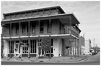 Historic brick building with balcony. Selma, Alabama, USA (black and white)