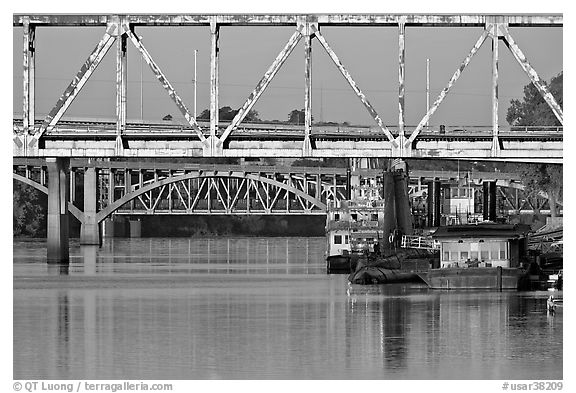 Bridges over Arkansas River, submarine and riverboats at sunrise. Little Rock, Arkansas, USA