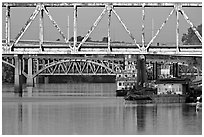 Bridges over Arkansas River, submarine and riverboats at sunrise. Little Rock, Arkansas, USA ( black and white)