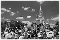 Girls on fathers shoulders, Cinderella Castle. Orlando, Florida, USA (black and white)