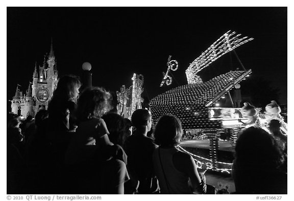 Families watching night parade, Magic Kingdom. Orlando, Florida, USA (black and white)