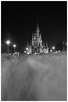 Blurred crowds and Cinderella Castle at night. Orlando, Florida, USA ( black and white)