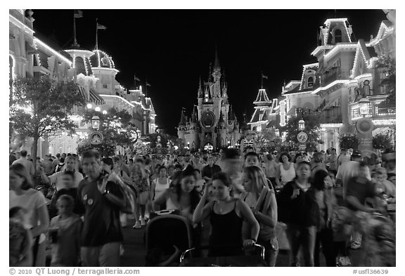 Main Street at night with crowds and castle. Orlando, Florida, USA