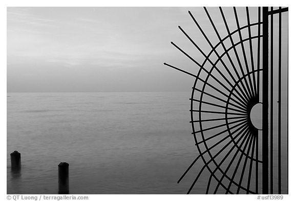 Grid and pilings and sunrise. Key West, Florida, USA (black and white)