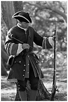 Man useing ramrod on musket, Fort Matanzas National Monument. St Augustine, Florida, USA ( black and white)
