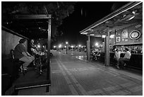 Salsa musicians and bar at night, Mallory Square. Key West, Florida, USA ( black and white)