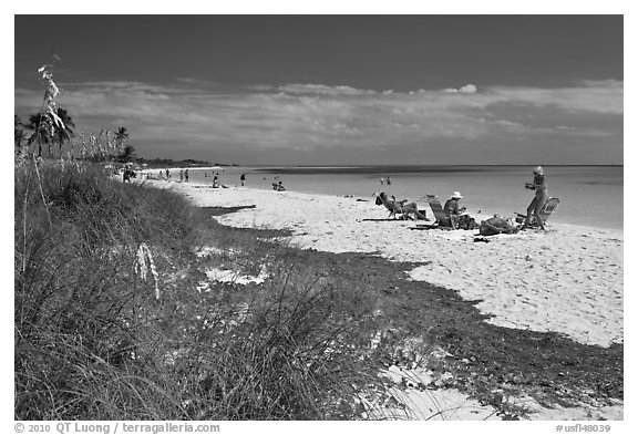 Beachgoers, Sandspur Beach, Bahia Honda State Park. The Keys, Florida, USA (black and white)