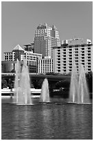 Fountains and downtown high-rises from Lake Lucerne. Orlando, Florida, USA ( black and white)