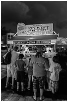 Key lime and conch fritters food stand at night. Key West, Florida, USA (black and white)