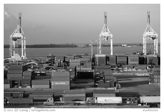Miami Port with trucks, containers and cranes. Florida, USA (black and white)