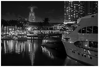 Yachts, Bayside Marketplace harbor and Freedom Tower illuminated at night, Miami. Florida, USA ( black and white)