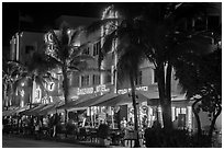 Art Deco hotels and restaurants with facades lit in bright colors, Miami Beach. Florida, USA ( black and white)