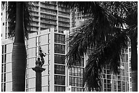 Palm tree leaves, statue, and high rises, Brickell, Miami. Florida, USA ( black and white)