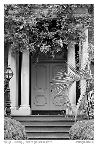 Doorway with luxuriant vegetation. Savannah, Georgia, USA (black and white)