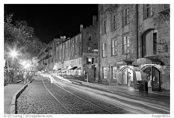 Car lights on River Street by night. Savannah, Georgia, USA (black and white)