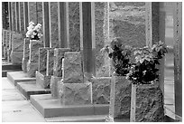 Flowers and tombs in Saint Louis cemetery. New Orleans, Louisiana, USA (black and white)