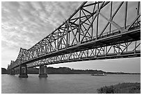 Barge on the Mississippi River approaching bridges. Natchez, Mississippi, USA ( black and white)