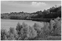 Banks of the Mississippi River with small boat. Natchez, Mississippi, USA (black and white)