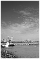 Mississippi River, paddle riverboat, and bridge. Natchez, Mississippi, USA (black and white)
