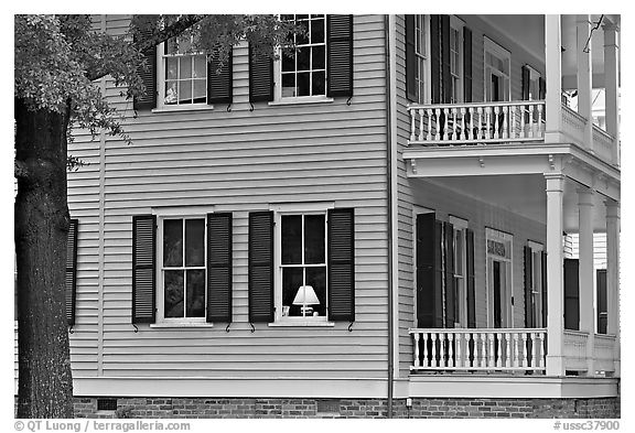 House with lamp inside window. Columbia, South Carolina, USA