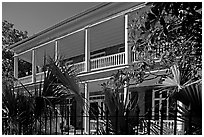 Facade of house with balconies and columns. Charleston, South Carolina, USA (black and white)