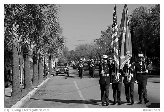 Marines carrying flag during parade. Beaufort, South Carolina, USA (black and white)