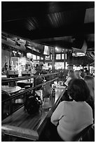 Patrons listen to musical performance in Beale Street bar. Memphis, Tennessee, USA ( black and white)