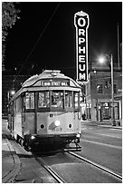 Trolley and Orpheum theater sign by night. Memphis, Tennessee, USA ( black and white)