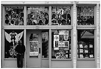 African-American man standing in front of blue storefront on Beal street. Memphis, Tennessee, USA (black and white)